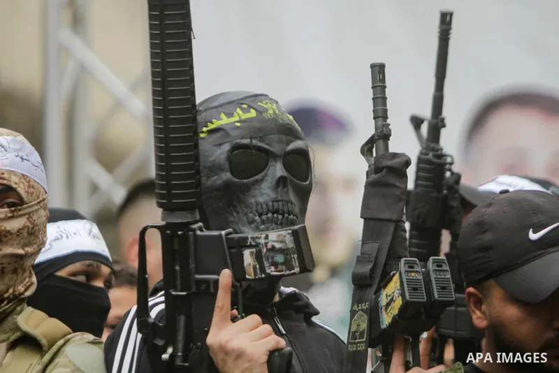 Palestinian gunmen from the Balata brigade of the Al-Aqsa Martyrs Brigades armed group, rally during a memorial service of Palestinians who killed by Israeli forces in the Balata refugee camp in the West Bank on May 5, 2...