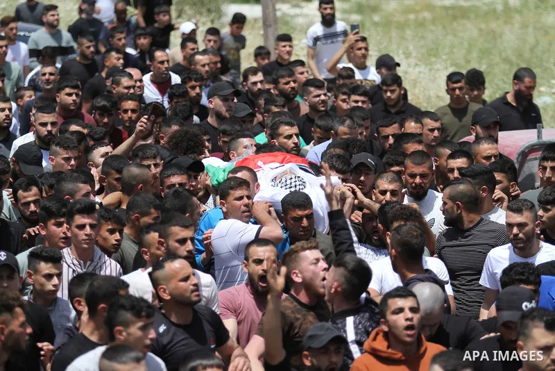 Palestinians carry the body of Aws Kamil, 30, who was died after he succumbed to his injuries sustained, during his funeral in the town of Qabatiya in the West Bank city of Jenin on May 11, 2023. Photo by Ahmed Ibrahim\...