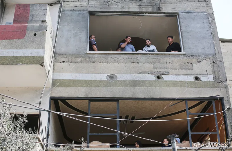 Palestinians inspect the damaged building in the aftermath of Israeli warplanes airstrikes in Beit Lahia in the northern of Gaza Strip on May 11, 2023. Israel and Gaza militants traded cross-border fire, renewing deadly...