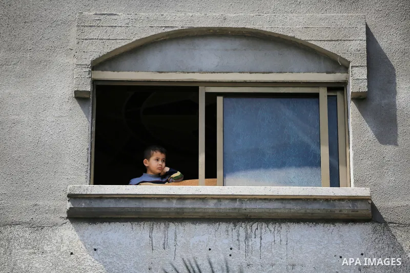 Palestinians inspect the damaged building in the aftermath of Israeli warplanes airstrikes in Beit Lahia in the northern of Gaza Strip on May 11, 2023. Israel and Gaza militants traded cross-border fire, renewing deadly...