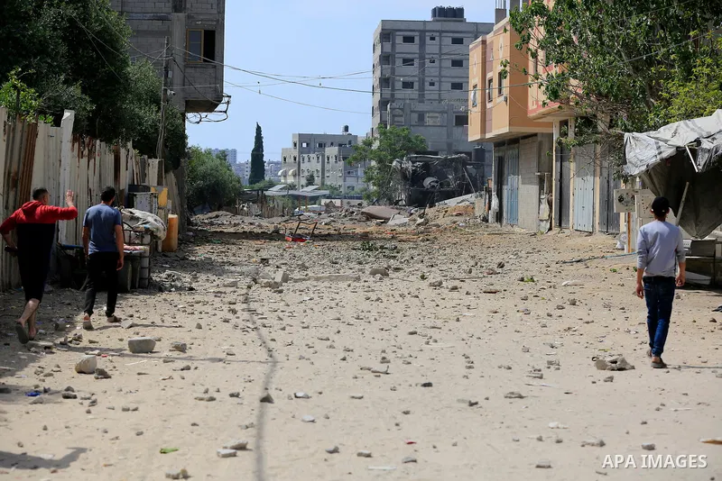 Palestinians inspect a house which was destroyed following an Israeli air strike in Beit Lahia in the northern Gaza Strip on May 12, 2023. Israel and Gaza militants traded heavy fire on May 12, as hopes faded of securing...