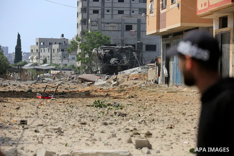 Palestinians inspect a house which was destroyed following an Israeli air strike in Beit Lahia in the northern Gaza Strip on May 12, 2023. Israel and Gaza militants traded heavy fire on May 12, as hopes faded of securing...