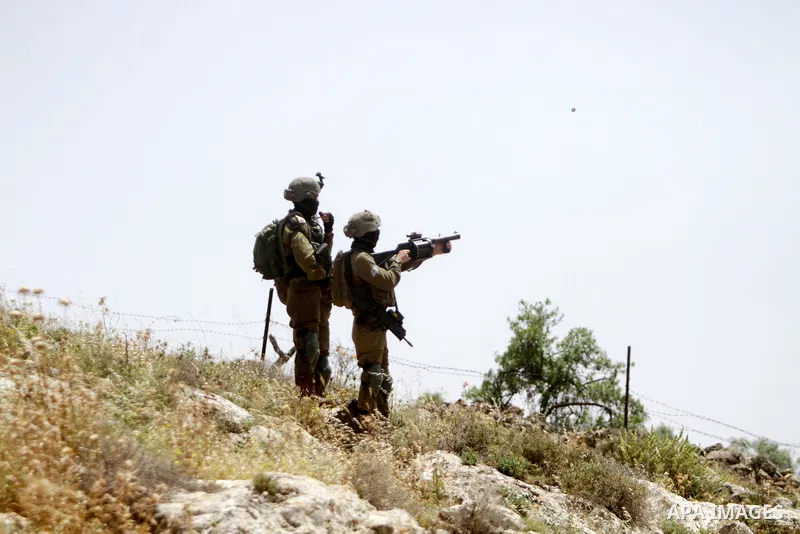 Clashes between Palestinian protesters and Israeli soldiers following a protest against the expansion of Jewish settlements, on May 12, 2023, in the West Bank village of Beit Dajan, east of Nablus. Photo by Mohammed Nass...