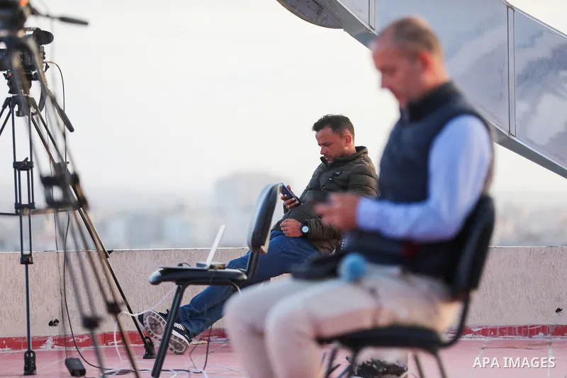 Palestinian journalists cover the conflict between Islamic Jihad movement and Israel in Gaza city on May 2023. Calm returned to Gaza as a fragile ceasefire ending five days of fighting held, leaving Palestinians and Isra...