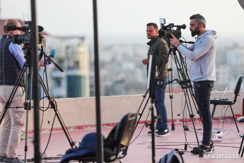 Palestinian journalists cover the conflict between Islamic Jihad movement and Israel in Gaza city on May 2023. Calm returned to Gaza as a fragile ceasefire ending five days of fighting held, leaving Palestinians and Isra...