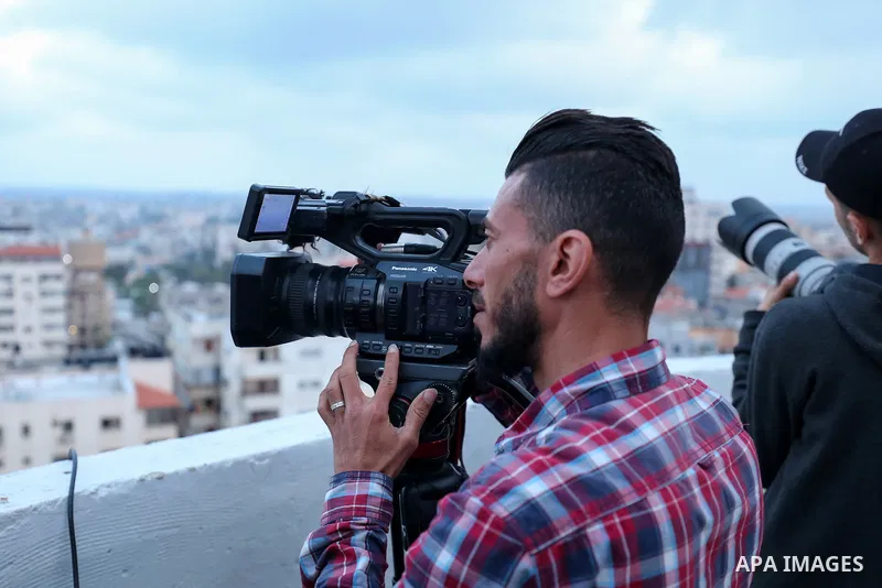 Palestinian journalists cover the conflict between Islamic Jihad movement and Israel in Gaza city on May 2023. Calm returned to Gaza as a fragile ceasefire ending five days of fighting held, leaving Palestinians and Isra...