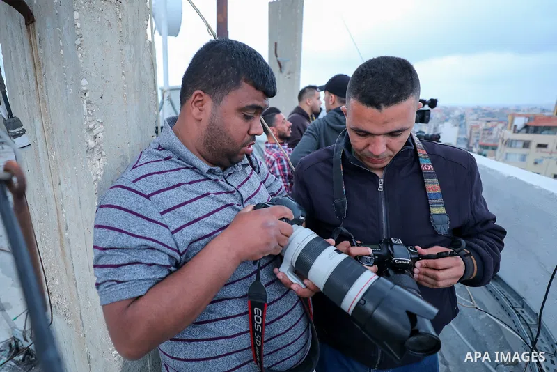 Palestinian journalists cover the conflict between Islamic Jihad movement and Israel in Gaza city on May 2023. Calm returned to Gaza as a fragile ceasefire ending five days of fighting held, leaving Palestinians and Isra...
