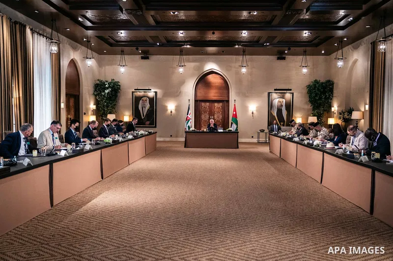 Jordan's King Abdullah II receives a delegation from the British Royal College of Defense Studies in Amman on May 16, 2023. Photo by Royal Hashemite Court/APAimages