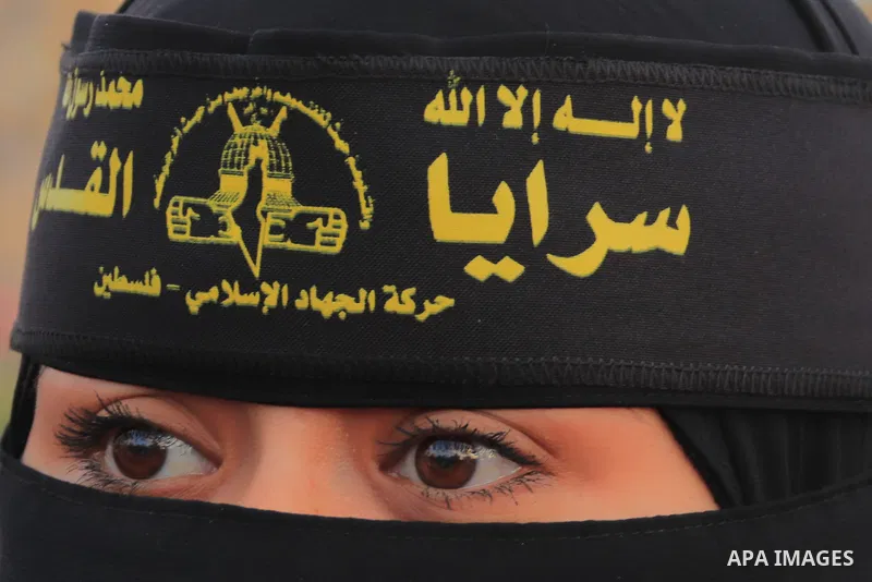 Supporters of the Islamic Jihad and armed men take part in a rally to commemorate the group's commanders and operatives killed by Israel in the recent cross-border conflict, in Gaza City on May 19, 2023. Tens of people w...