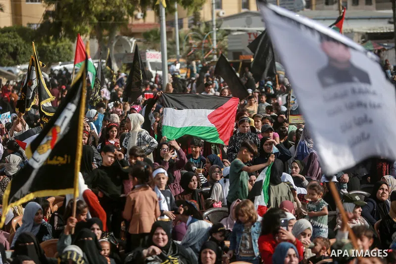 Supporters of the Islamic Jihad and armed men take part in a rally to commemorate the group's commanders and operatives killed by Israel in the recent cross-border conflict, in Gaza City on May 19, 2023. Tens of people w...