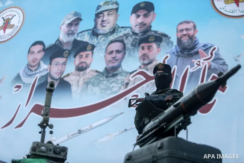Supporters of the Islamic Jihad and armed men take part in a rally to commemorate the group's commanders and operatives killed by Israel in the recent cross-border conflict, in Gaza City on May 19, 2023. Tens of people w...