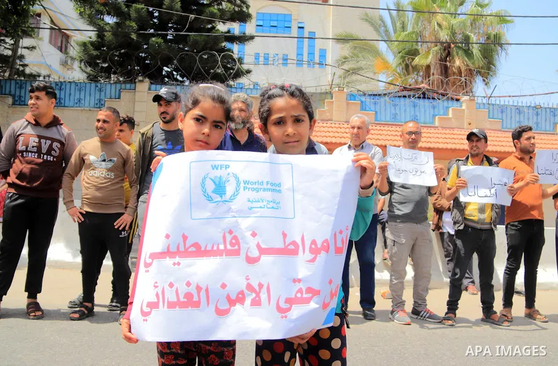 Palestinians of WFP beneficiaries take part in a protest against the stopping of aid, in front of United Nations Development Programme office (UNDP) in Gaza city on May 21, 2023. WFP pauses food distribution in Gaza foll...
