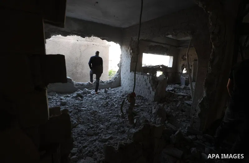 People inspect home of Palestinian youth Mutaz Khawaja demolished by Israeli forces in the village of Ni'lin, west of the West Bank city of Ramallah, on May 23, 2023. In a punitive measure, Israeli forces today blew up t...