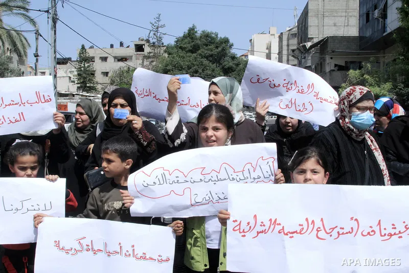 Palestinians of WFP beneficiaries take part in a protest against the stopping of aid, in front of United Nations Development Programme office (UNDP) in Gaza city on May 24, 2023. WFP pauses food distribution in Gaza foll...
