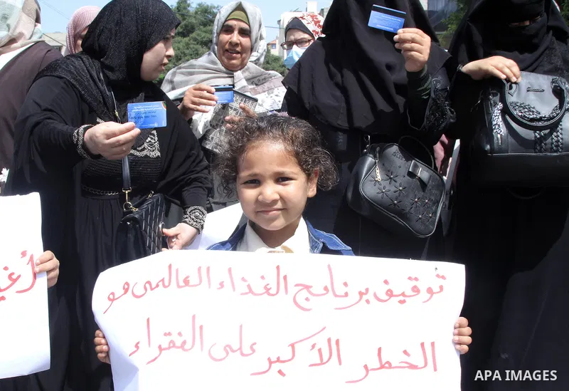 Palestinians of WFP beneficiaries take part in a protest against the stopping of aid, in front of United Nations Development Programme office (UNDP) in Gaza city on May 24, 2023. WFP pauses food distribution in Gaza foll...