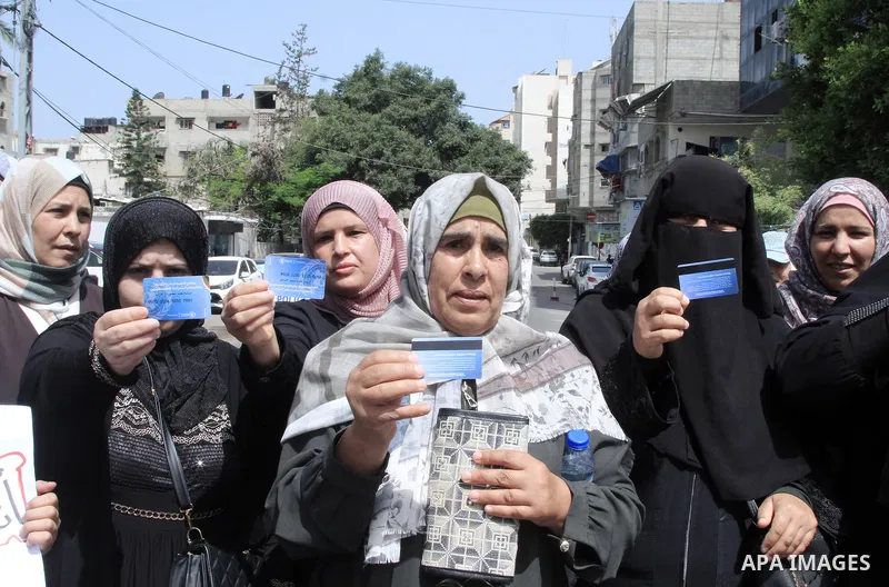 Palestinians of WFP beneficiaries take part in a protest against the stopping of aid, in front of United Nations Development Programme office (UNDP) in Gaza city on May 24, 2023. WFP pauses food distribution in Gaza foll...