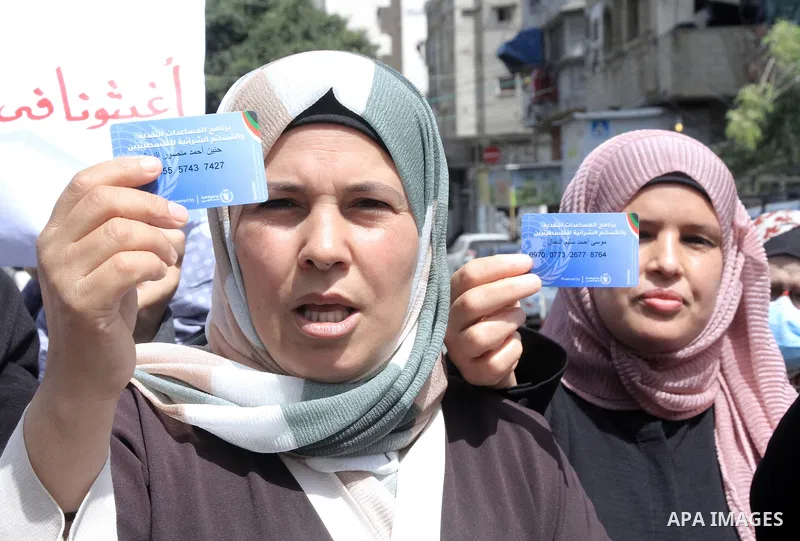 Palestinians of WFP beneficiaries take part in a protest against the stopping of aid, in front of United Nations Development Programme office (UNDP) in Gaza city on May 24, 2023. WFP pauses food distribution in Gaza foll...