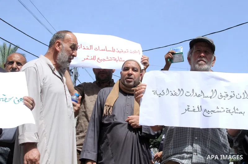 Palestinians of WFP beneficiaries take part in a protest against the stopping of aid, in front of United Nations Development Programme office (UNDP) in Gaza city on May 24, 2023. WFP pauses food distribution in Gaza foll...