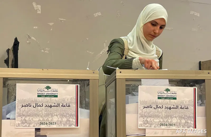 Palestinian students cast their votes in the student council elections at Birzeit University on the outskirts of Ramallah in the West Bank, on May 24, 2022. Photo by Ahmad Arouri \ apaimages