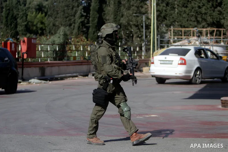 Israeli forces gather at the scene where an Israeli settler killed during shooting attack outside of Hermesh settlement in the northern West Bank on May 30, 2023. Photo by Mohammed Nasser\ apaimages