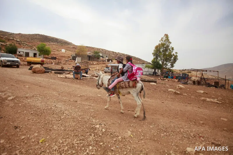 Bedouin Palestinians outside their dwellings in the Jordanian valley, in the northern West Bank on June 1, 2023. The Israeli authorities handed the Palestinians in the Jordan Valley 11 notices to demolish their homes. Ph...