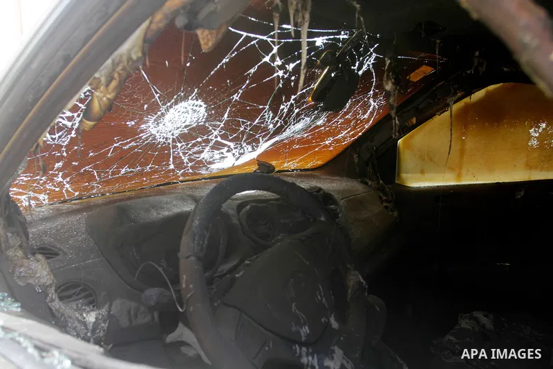 Palestinians inspect the burned cars which were set on fire by Jewish settlers in the village of Burqa, northwest of the West Bank city of Nablus on June 05, 2023. Ghassan Daghlas, who monitors settlement activities in t...