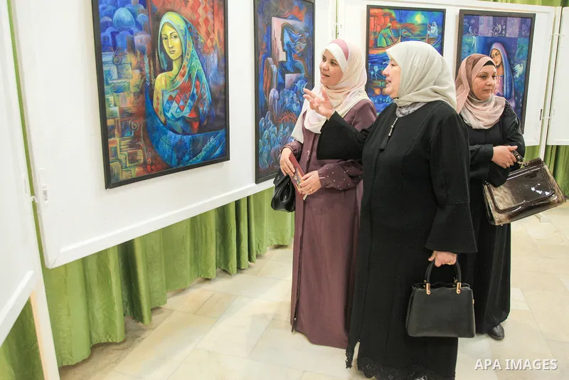 Palestinians attend the painting exhibition "Dream and Reality" by artist Tahani Skaik, in Gaza city on June 05, 2023. Photo by Omar Al-Dirawi\ apaimages