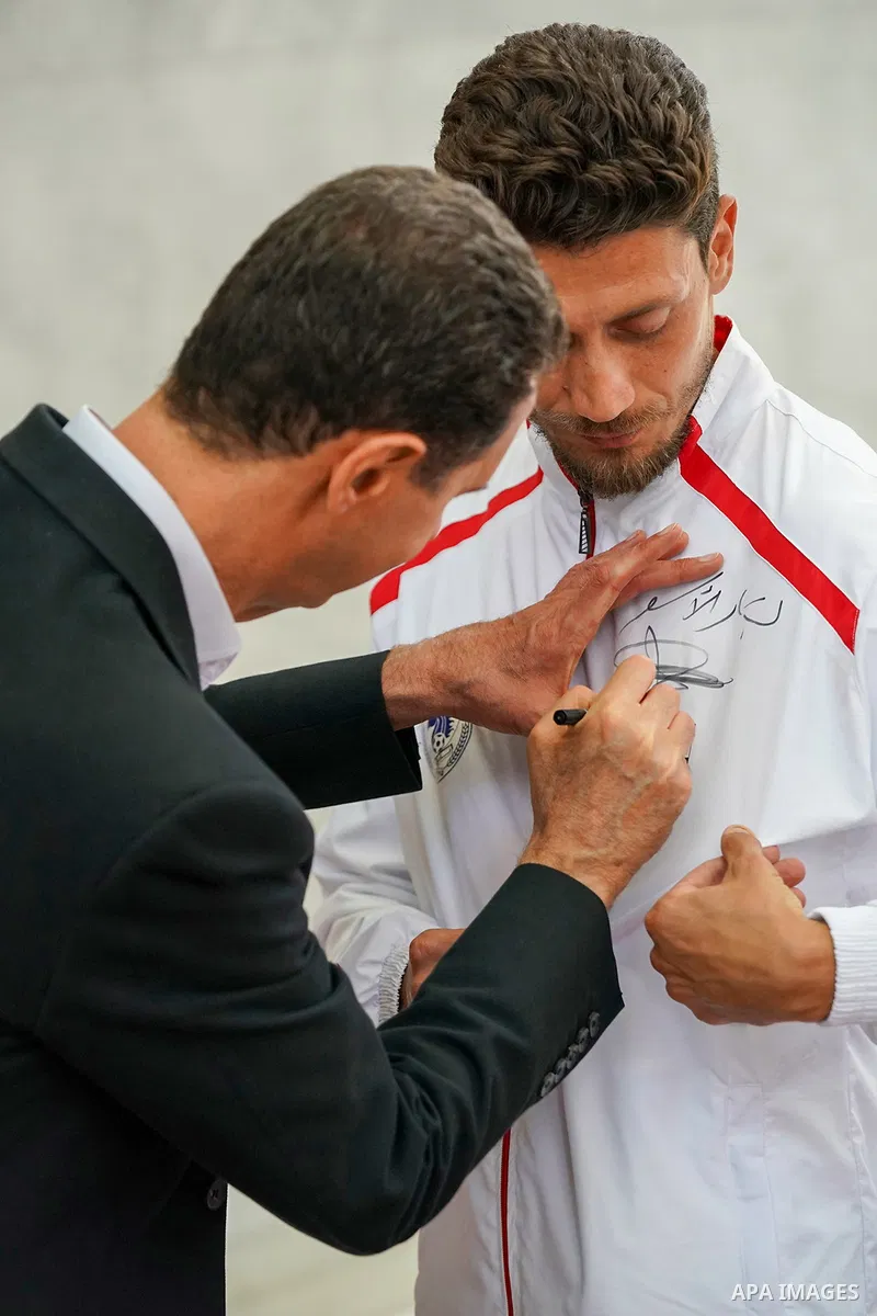 Syrian President Bashar Al-Assad meets with the players of the al-Futowa team, which won the Syrian local league championship, in Damascus, on June 7, 2023. Photo by Syrian Presidency\ apaimages