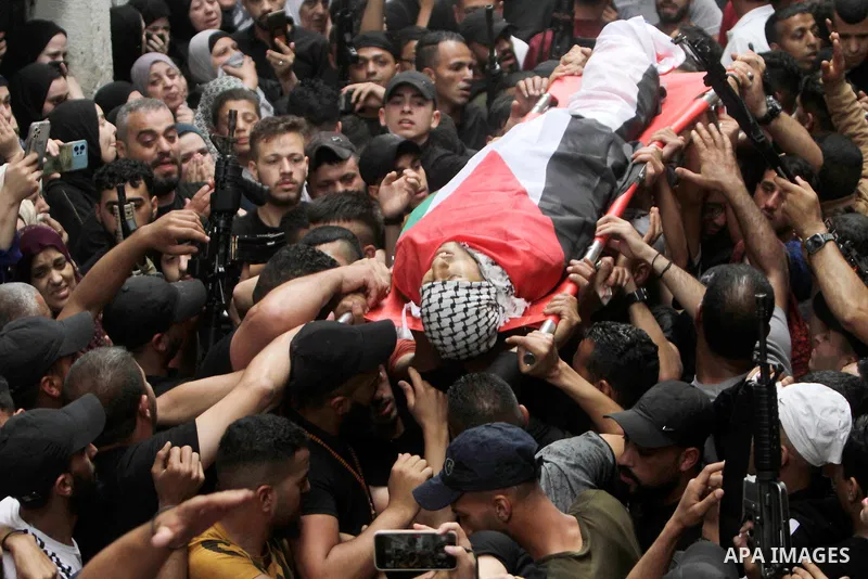 Palestinians attend the funeral of Faris Hashash who was killed during clashes with Israeli forces, at the Balata refugee camp on the outskirts of Nablus, in the West Bank, on June 13, 2023. Photo by Mohammed Nasser\ apa...
