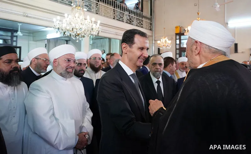 Syrian President Bashar al-Assad attends the prayer of Eid al-Adha or feast of the sacrifice at the Al-Afram Mosque in Damascus, in Syria on June 28, 2023. Photo by Syrian Presidency\ apaimages
