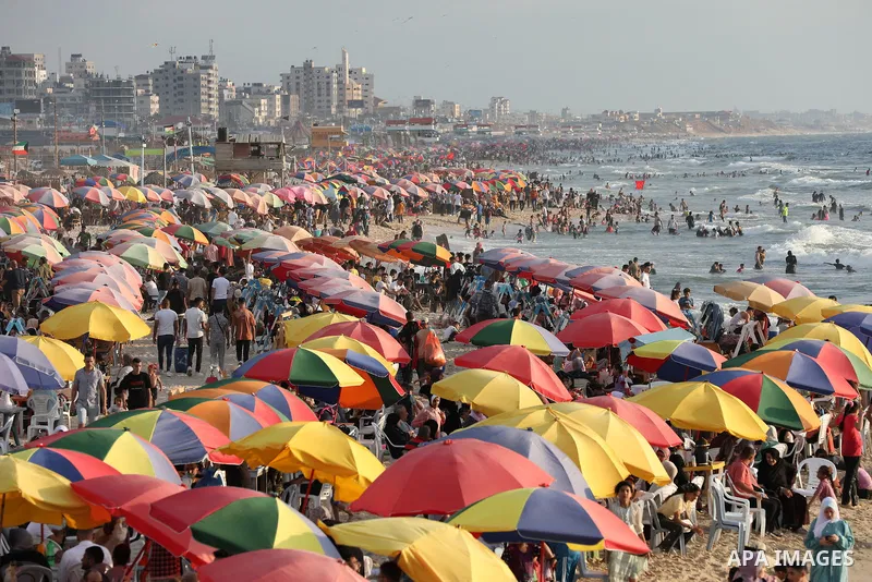 Palestinians gather on the Gaza sea's beach on the third day of Eid al-Adha on June 30, 2023. Known as the "big" festival, Eid al-Adha, or Feast of Sacrifice, is celebrated each year by Muslims sacrificing various animal...