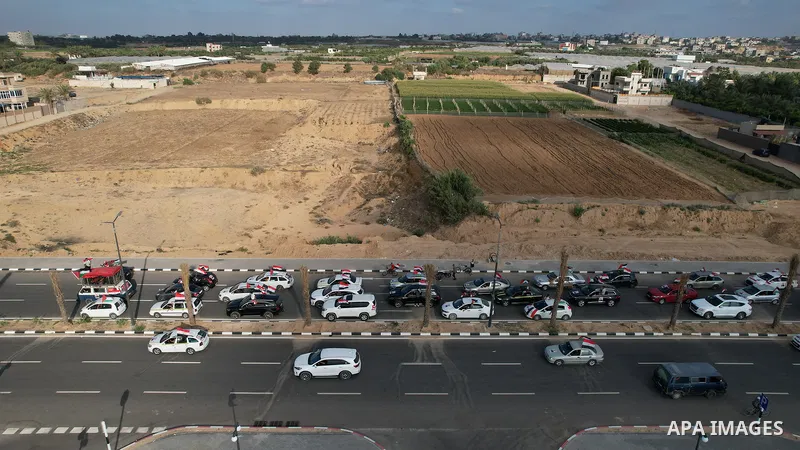 Palestinians carry the Egyptian flags and portraits of Egyptian President Abdel Fattah El-Sisi on the "Egypt" Corniche, which was built by the Arab Republic of Egypt in the northern Gaza Strip on June 30, 2023.. Photo by...