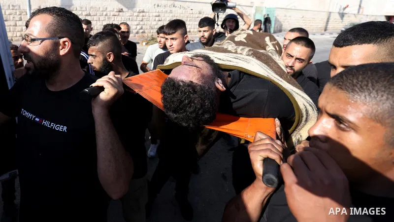 July 4, 2023, Jenin, West Bank, Occupied Territories: Palestinians carry a dead body evacuated from Jenin camp during the second day of an Israeli military operation in the camp, West Bank. The Israeli army stated on 03...