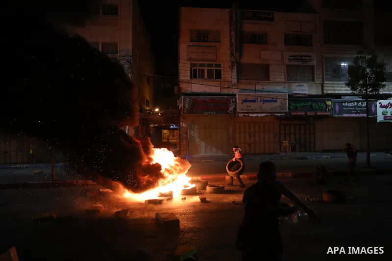Palestinian protesters clash with Israeli forces following a demonstration in the West Bank city of Hebron protesting an Israeli military operation in Jenin for the second day, on July 4, 2023. Eight Palestinians were sh...