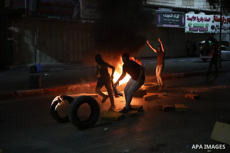 Palestinian protesters clash with Israeli forces following a demonstration in the West Bank city of Hebron protesting an Israeli military operation in Jenin for the second day, on July 4, 2023. Eight Palestinians were sh...