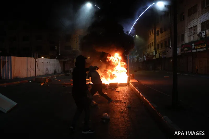 Palestinian protesters clash with Israeli forces following a demonstration in the West Bank city of Hebron protesting an Israeli military operation in Jenin for the second day, on July 4, 2023. Eight Palestinians were sh...