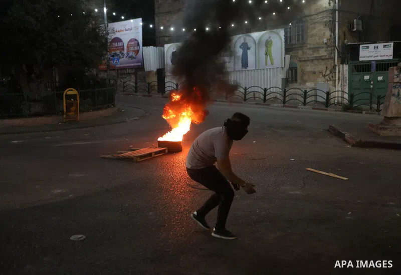 Palestinian protesters clash with Israeli forces following a demonstration in the West Bank city of Hebron protesting an Israeli military operation in Jenin for the second day, on July 4, 2023. Eight Palestinians were sh...