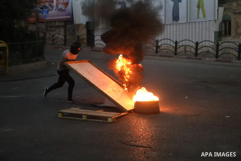 Palestinian protesters clash with Israeli forces following a demonstration in the West Bank city of Hebron protesting an Israeli military operation in Jenin for the second day, on July 4, 2023. Eight Palestinians were sh...
