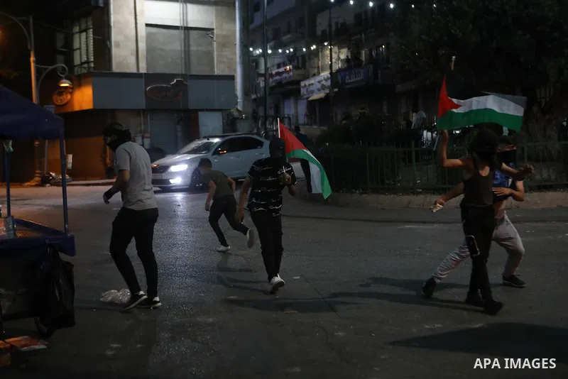 Palestinian protesters clash with Israeli forces following a demonstration in the West Bank city of Hebron protesting an Israeli military operation in Jenin for the second day, on July 4, 2023. Eight Palestinians were sh...