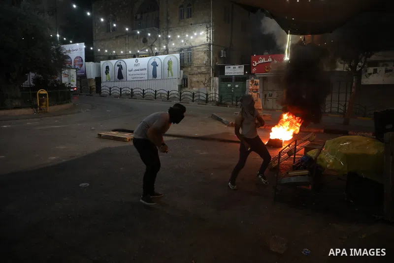 Palestinian protesters clash with Israeli forces following a demonstration in the West Bank city of Hebron protesting an Israeli military operation in Jenin for the second day, on July 4, 2023. Eight Palestinians were sh...