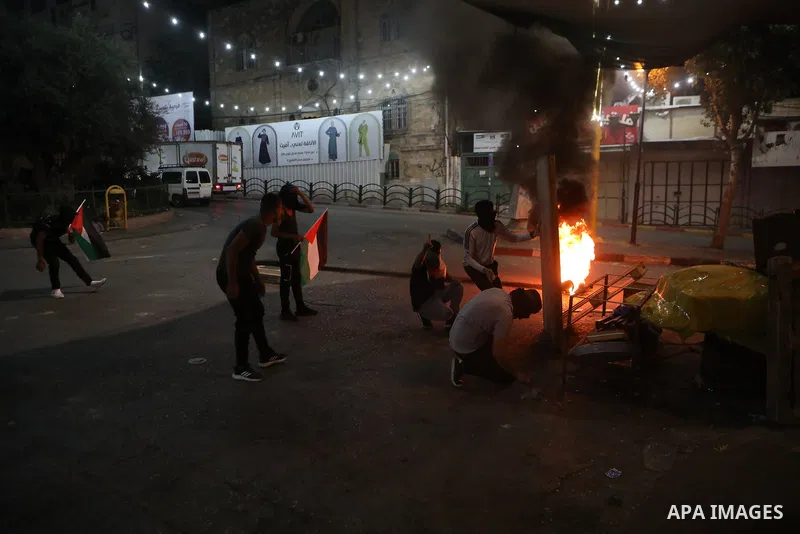 Palestinian protesters clash with Israeli forces following a demonstration in the West Bank city of Hebron protesting an Israeli military operation in Jenin for the second day, on July 4, 2023. Eight Palestinians were sh...
