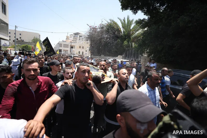 July 5, 2023, JENIN: Jenin (-), 05/07/2023.- Mourners carry one of the bodies during the funeral of 13 Palestinians killed in the Israeli army raid in the West Bank city of Jenin, 05 July 2023. The Israeli army announced...