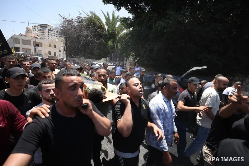 July 5, 2023, JENIN: Jenin (-), 05/07/2023.- Mourners carry one of the bodies during the funeral of 13 Palestinians killed in the Israeli army raid in the West Bank city of Jenin, 05 July 2023. The Israeli army announced...
