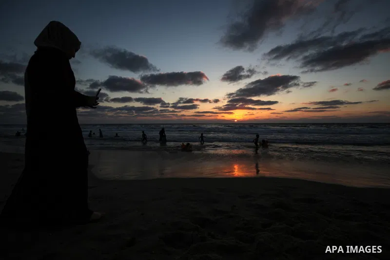 Palesinians enjoy their time on the beach of Gaza city during sunset on July 5, 2023. Photo by Omar Ashtawy\ apaimages