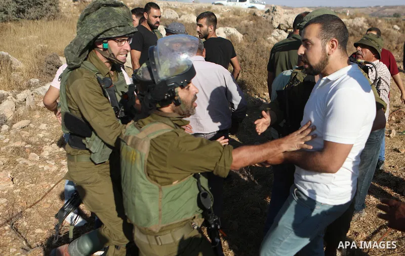 Israeli soldiers clash with Palestinians protesting Israeli settlers (not pictured) who set up tents on lands in Halhoul village north of Hebron in the occupied West Bank, on August 1, 2023. Photo by Mamoun Wazwaz
