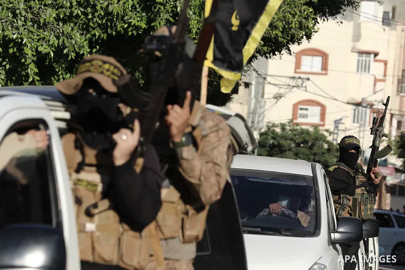Militants from Al-Quds Brigades, the military wing of Palestinian Islamic Jihad movement, participate in a military parade on the first anniversary of the Israeli escalation in the Gaza Strip, in Gaza city on August 05,...