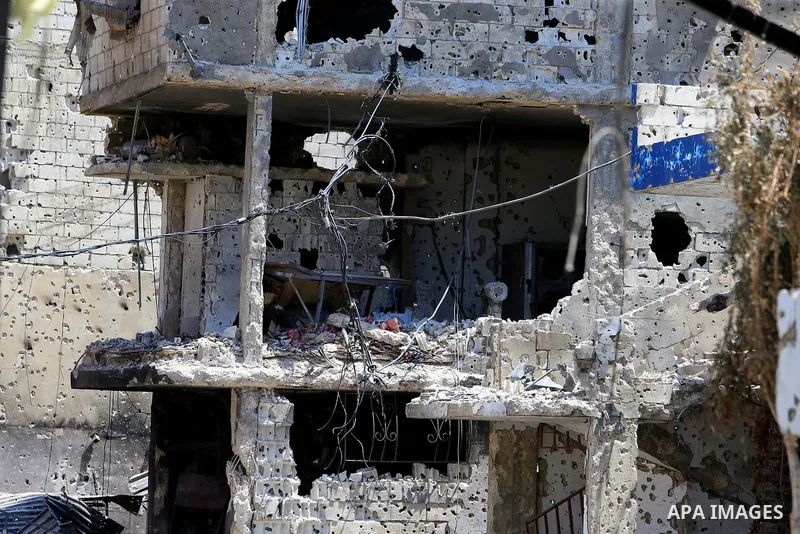 BEIRUT, Aug. 5, 2023 This photo taken on Aug. 4, 2023 shows a building damaged in armed clashes in the Ain Al-Helweh Palestinian refugee camp in Sidon, southern Lebanon. Several armed clashes broke out in the Ain Al-Helw...