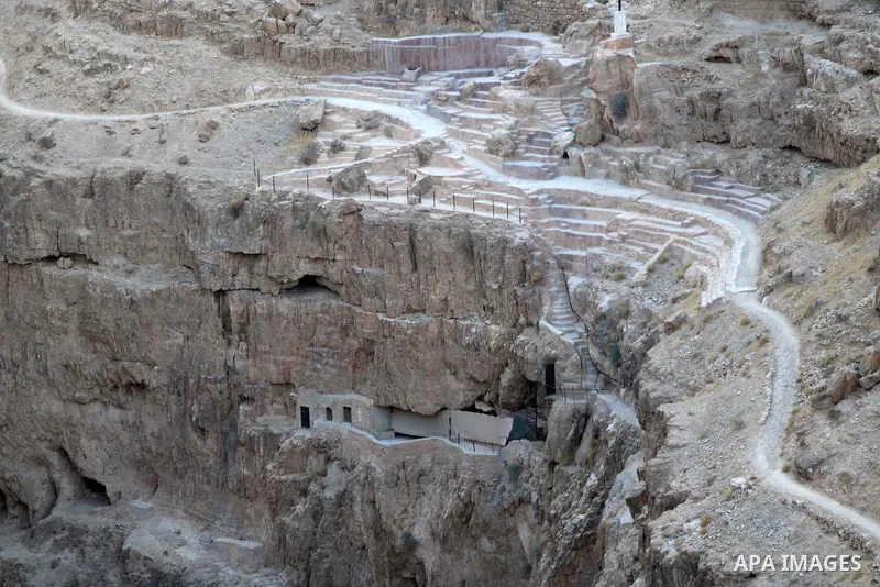 Monastery of Saints George or Wadi Qelt are seen in the desert between Jerusalem and Jericho on August 27, 2023. St. George's Monastery is a Greek Orthodox cliff-hanging complex carved into a sheer rock wall in the Judae...