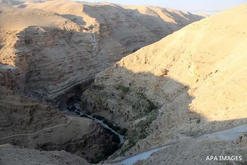 Monastery of Saints George or Wadi Qelt are seen in the desert between Jerusalem and Jericho on August 27, 2023. St. George's Monastery is a Greek Orthodox cliff-hanging complex carved into a sheer rock wall in the Judae...