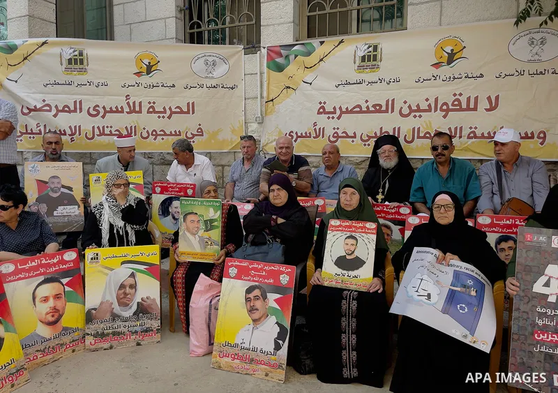 Palestinians take part in a protest to demand the return of the bodies of their slain relatives held by Israeli forces, in front of Red cross office in the West Bank city of Ramallah on August 29, 2023. Israeli authoriti...